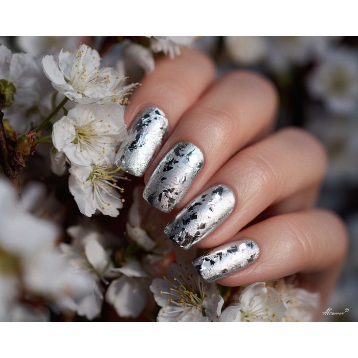silver nails, metallic manicure, foil leaf nail art, cool palette nails, white blossoms still life, luxury silver polish, sleek manicure painting, shimmering nail artwork, cold silver color décor