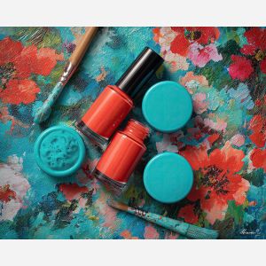 coral nails, vibrant nail polish, turquoise background art, beauty product still life, bright manicure scene, floral accents painting, coral color palette, bold nail artwork