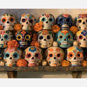 ceramic calaveras, sugar skull painting, dia de muertos decor, day of the dead oil painting, mexican ceramic art, colorful skull decor, cultural wall art, festive still life, marigold art, seasonal painting