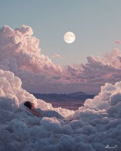 WOMAN SLEEPING ON CLOUDS